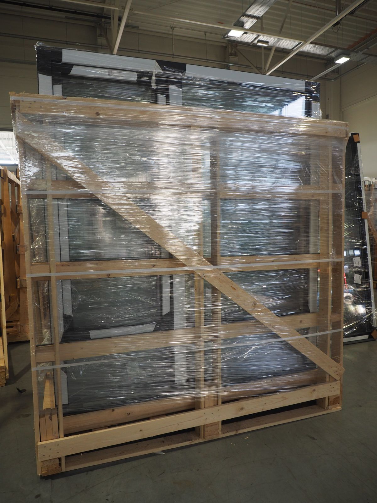Braced as a stack and moved once. Every extra handling is another chance to twist a frame.
