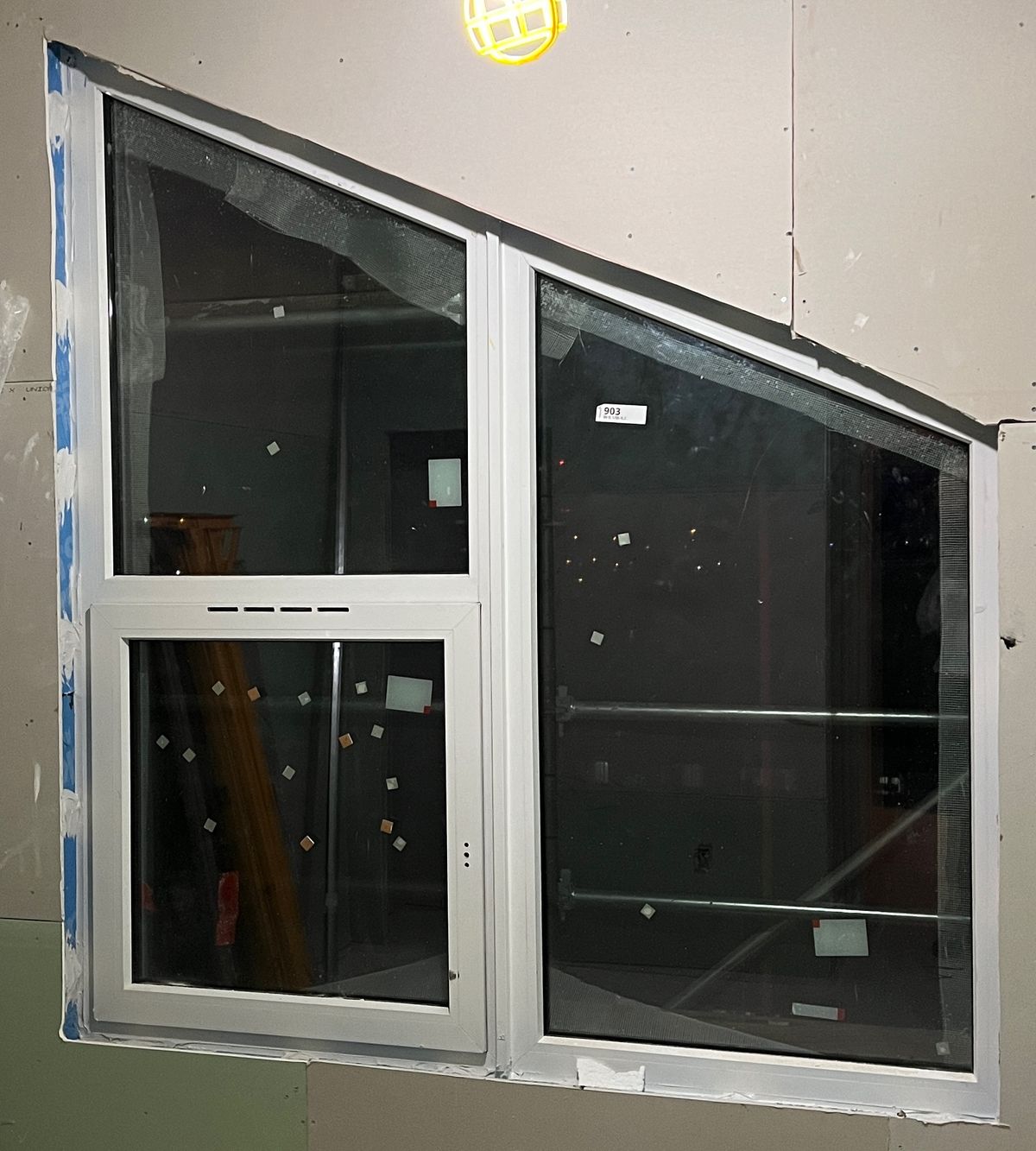 An angled-head window on a building under construction