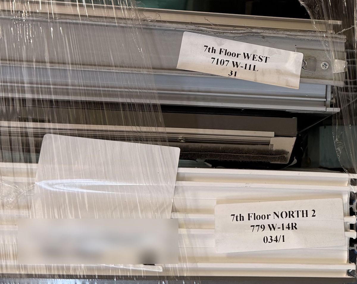 Stickers on packed units reading 7th Floor North 2, 779, W-14R and 7th Floor West, 7107, W-11L