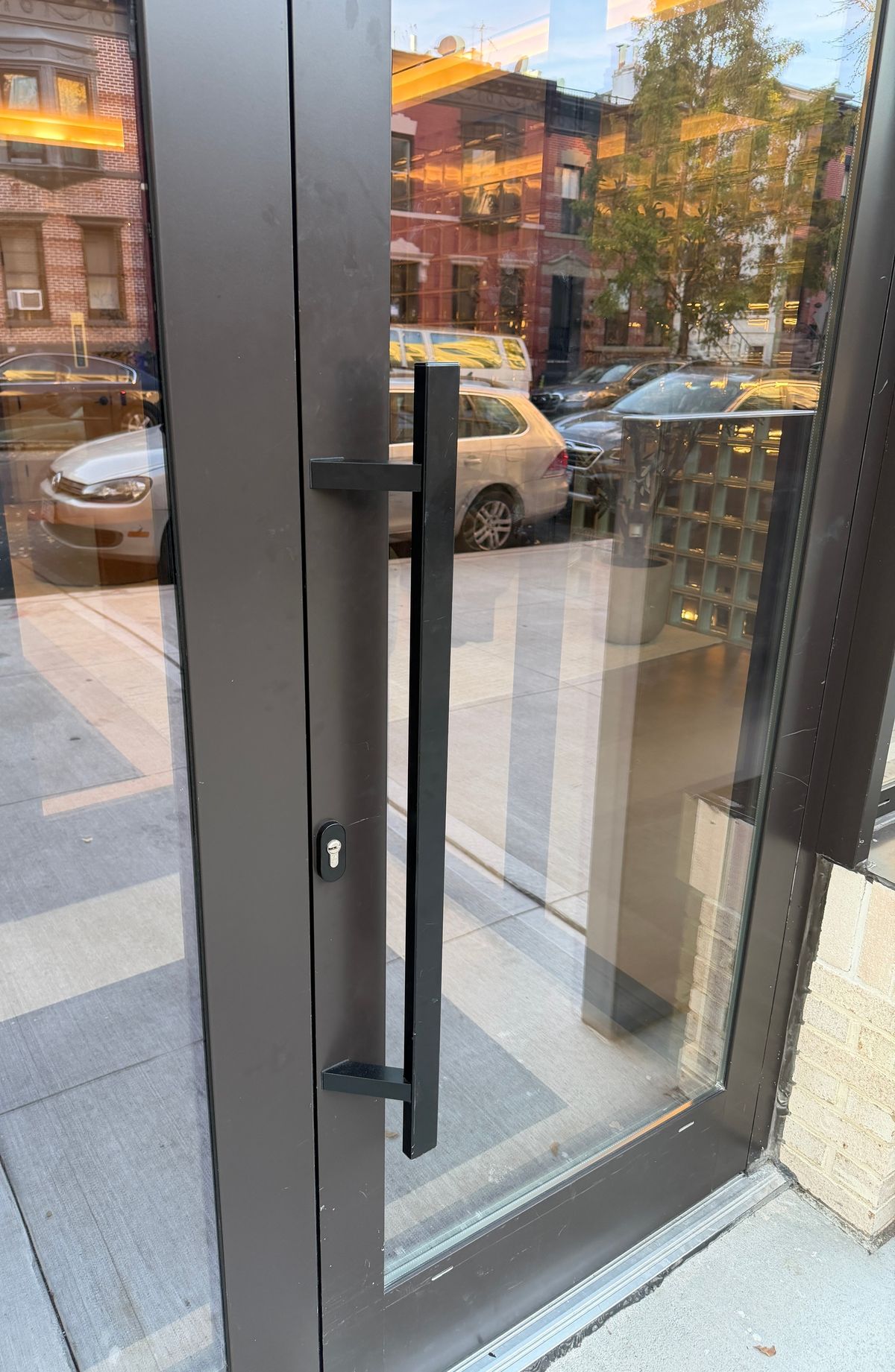Lincoln Place: the outside pull and lock cylinder on the entrance door