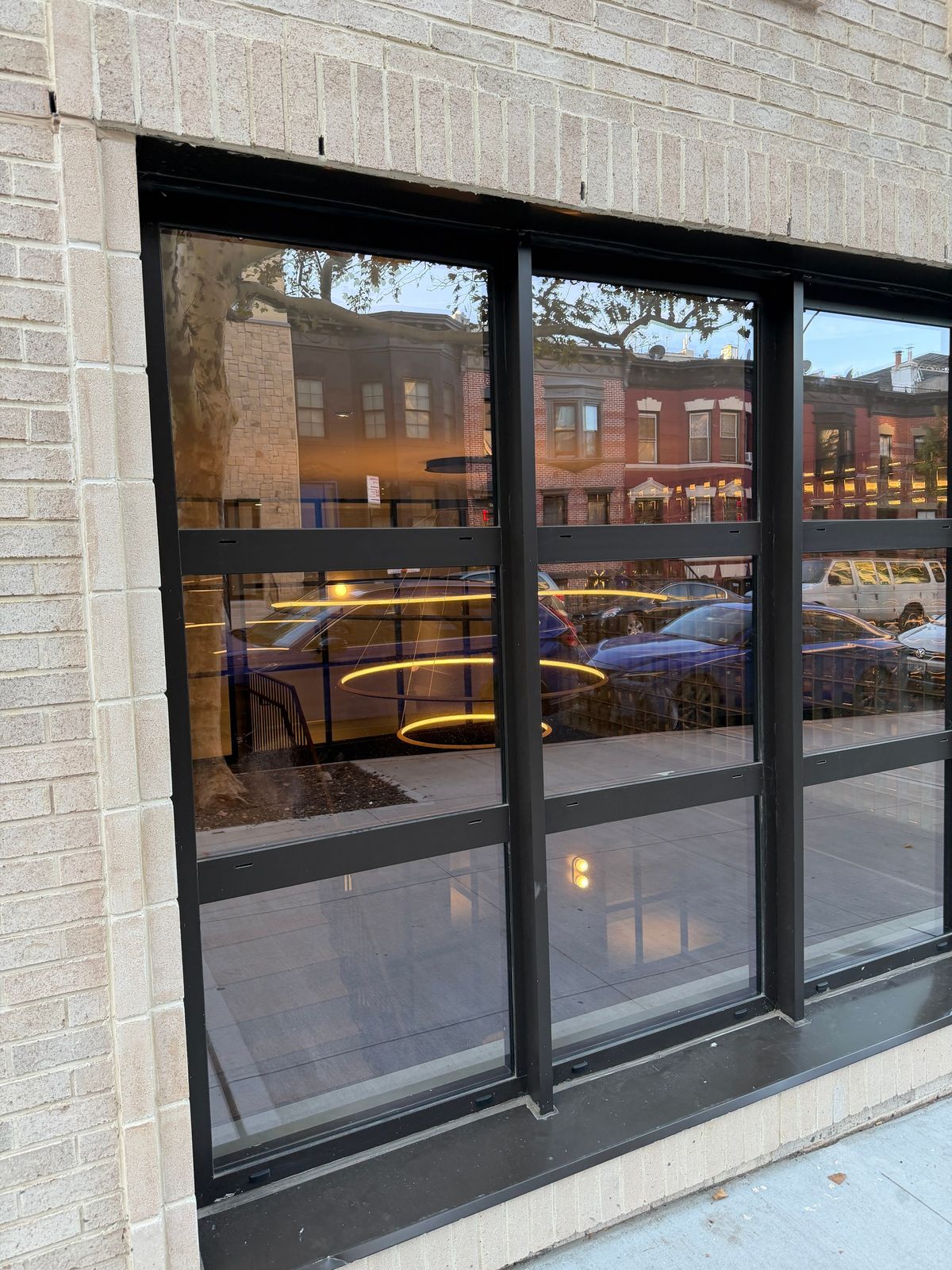 Lincoln Place: a fixed storefront bay beside the entrance